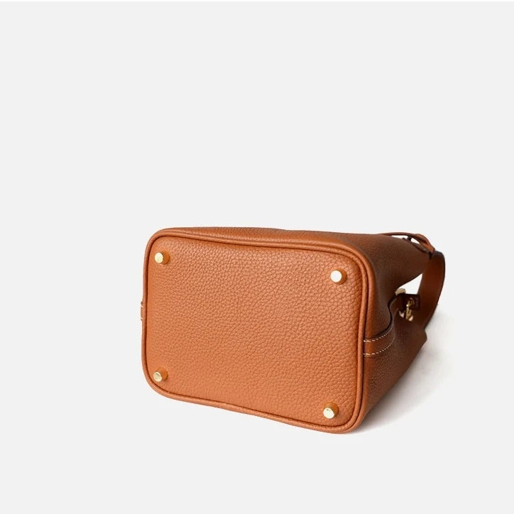 Sac seau Portico Danoir Paris en cuir orange avec cordons, idéal pour un style élégant et pratique.