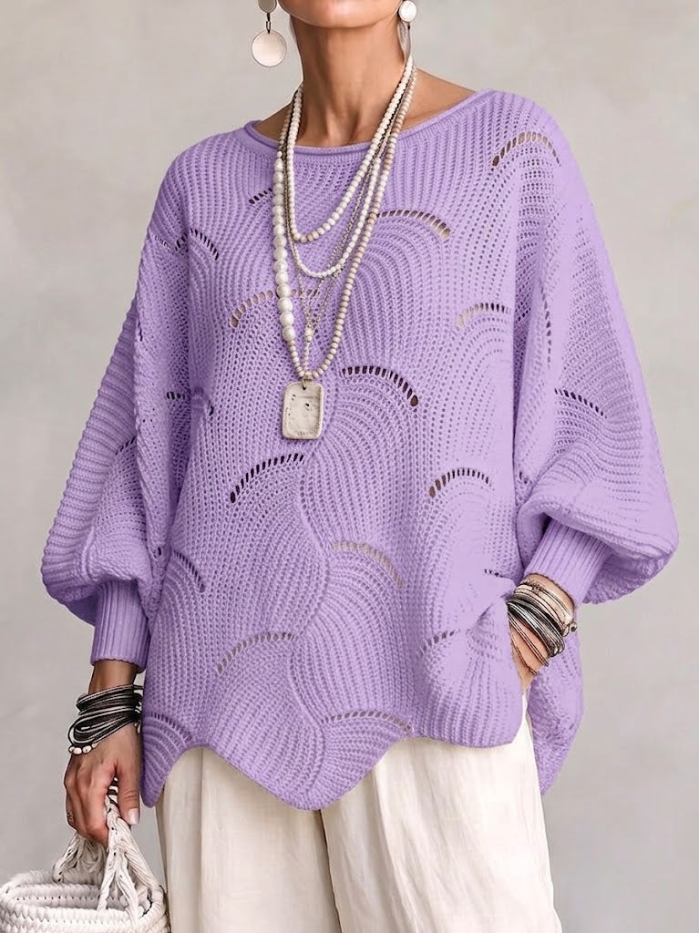 Haut en tricot Danoir Paris avec manches lanternes amples et motif en vagues creuses, vue de face sur un fond neutre.