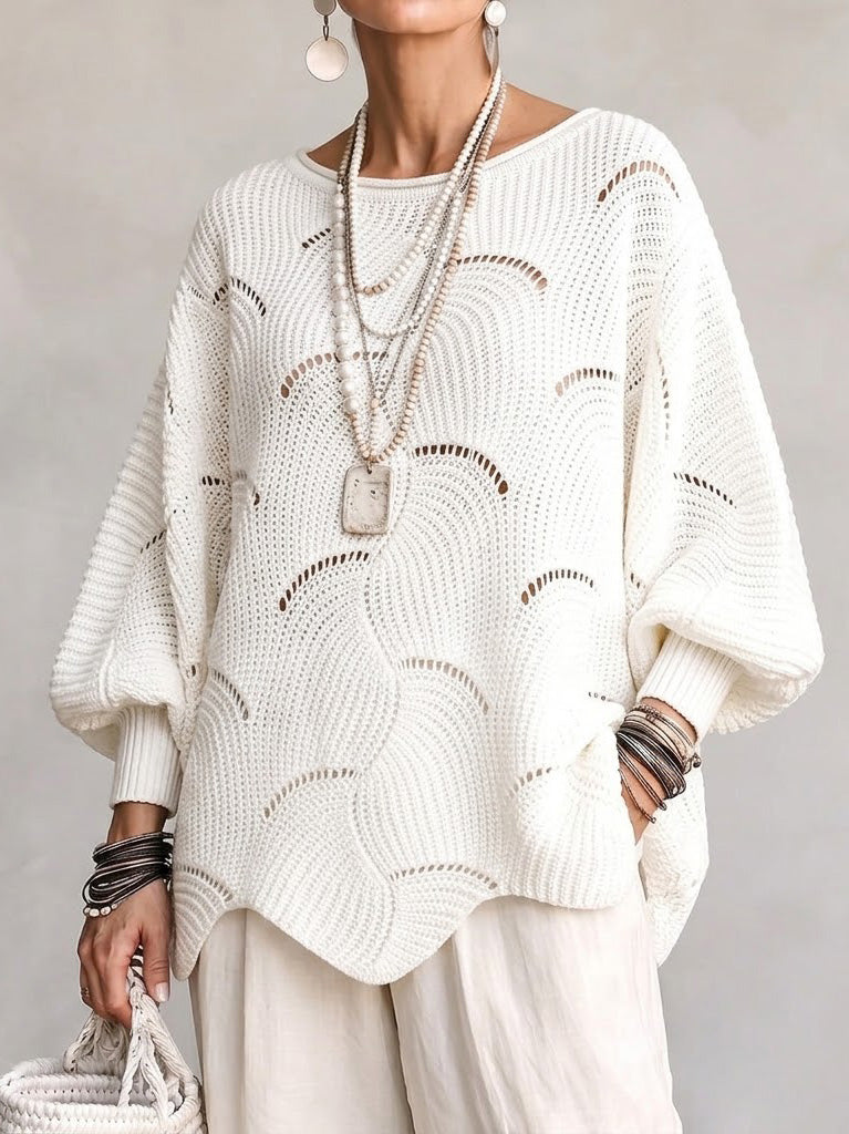 Haut en tricot Danoir Paris à manches lanternes amples avec motif en vagues creuses, visible en détail sur l’image.