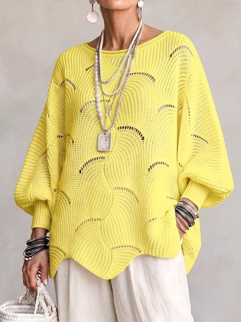 Haut en tricot Danoir Paris avec manches lanternes amples et motif en vagues creuses, visible en détail.