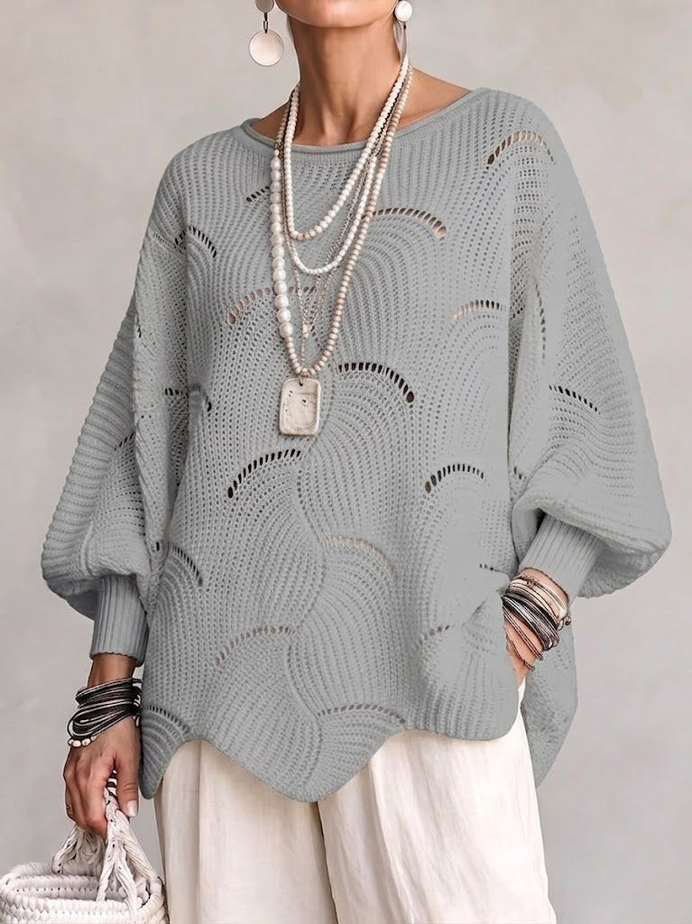 Haut en tricot Danoir Paris à manches lanternes amples avec motif en vagues creuses, couleur neutre et texture douce.