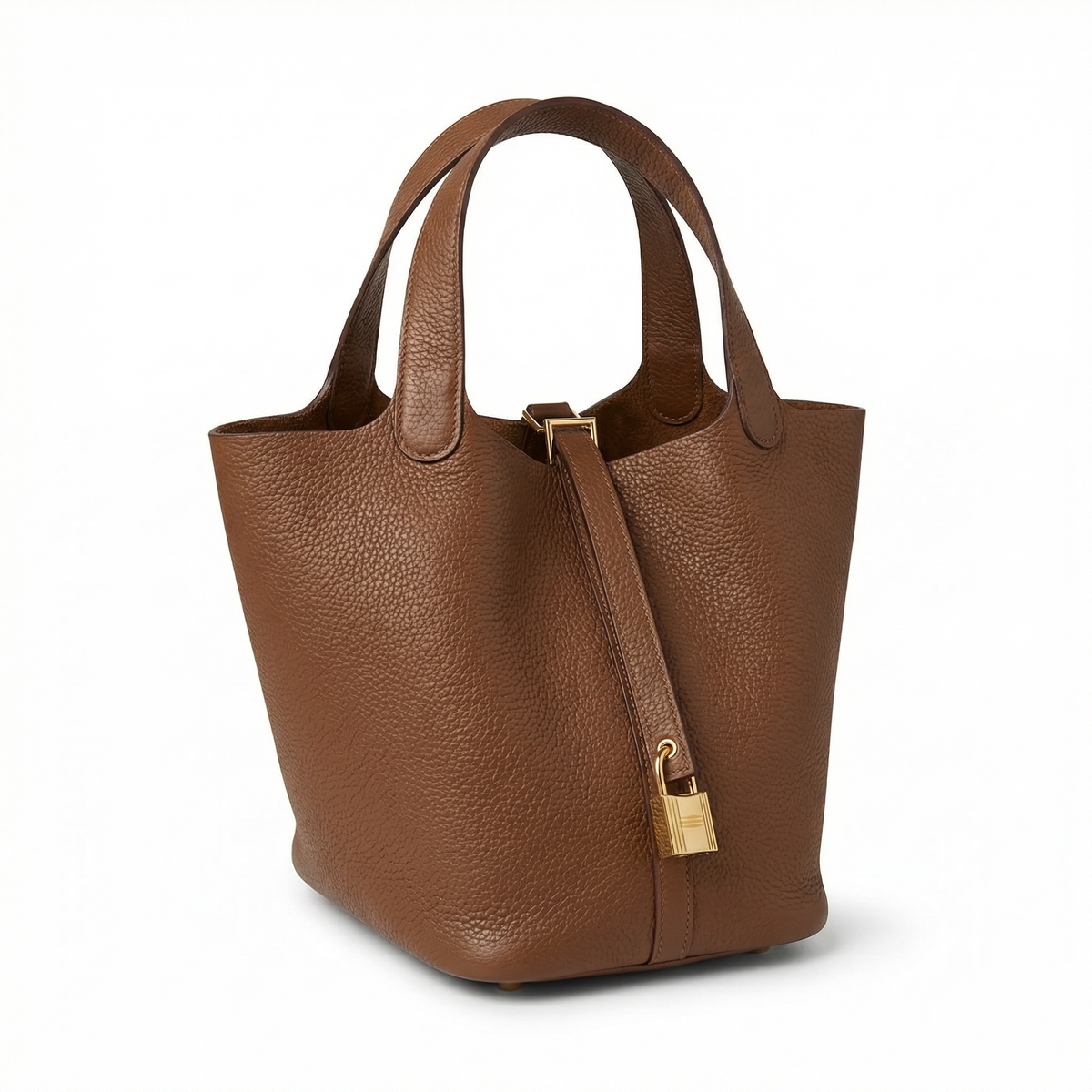 Sac seau Portico de Danoir Paris en cuir marron, avec poignée robuste et design élégant, posé sur une surface en bois.