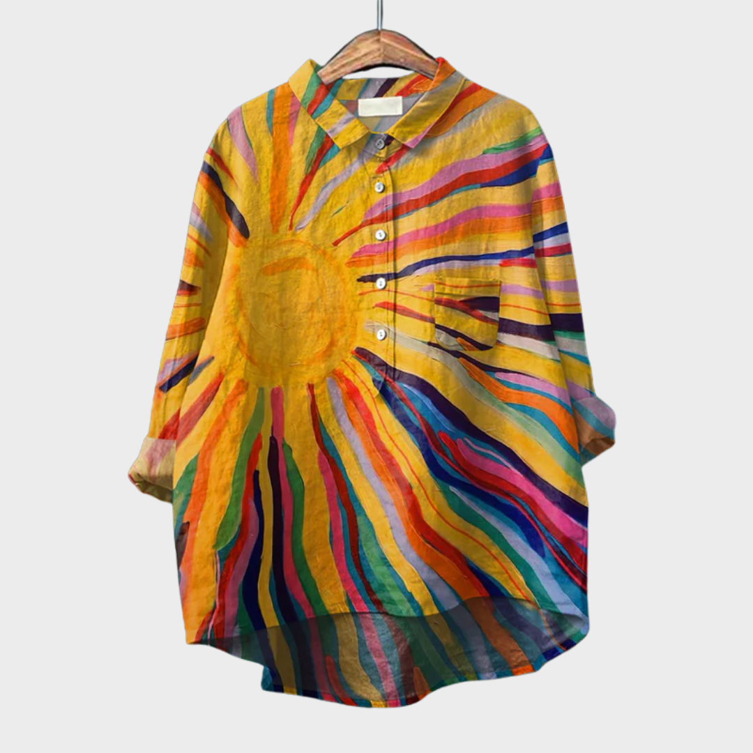 Chemise élégante Danoir Paris Marielle avec boutons, tissu rayonnant et coupe fluide, portée décontractée ou habillée.